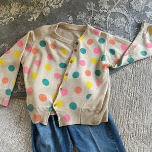 Unique cardigan with a sideways button front!